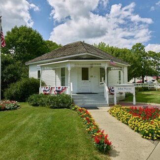 John Wayne's four-room birthplace home on John Wayne Drive in Winterset, Iowa, was built in the 1880s The legendary American actor John Waynes four-room birthplace home on John Wayne Drive in Winterset, Iowa, was built in the 1880s. (Marion Robert Morrison, who one one day adopt John Wayne as a stage name) weighed 13 pounds at birth on May 26, 1907.) His father Clyde, a pharmacist, and mother Molly, a telephone operator, lived in the house for three years before moving the family to the larger town of Earlham, Iowa, and then to California. The house (as of 2016) has its original floor, stained glass, and bulls-eye woodwork. Its period furniture was donated.